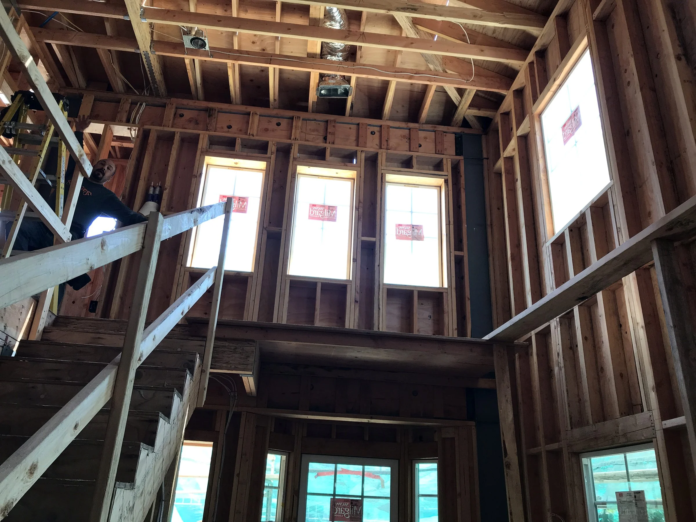 Two-story interior framing with tall windows
